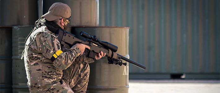 Player with a spring-powered sniper replica