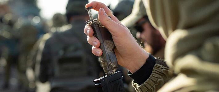 Player reloading their magazine with a speedloader