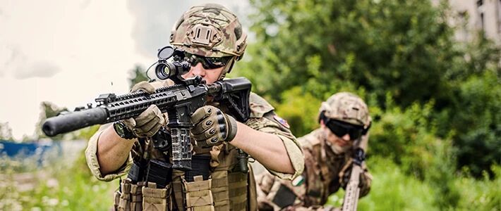 Airsoft player with a long assault replica  