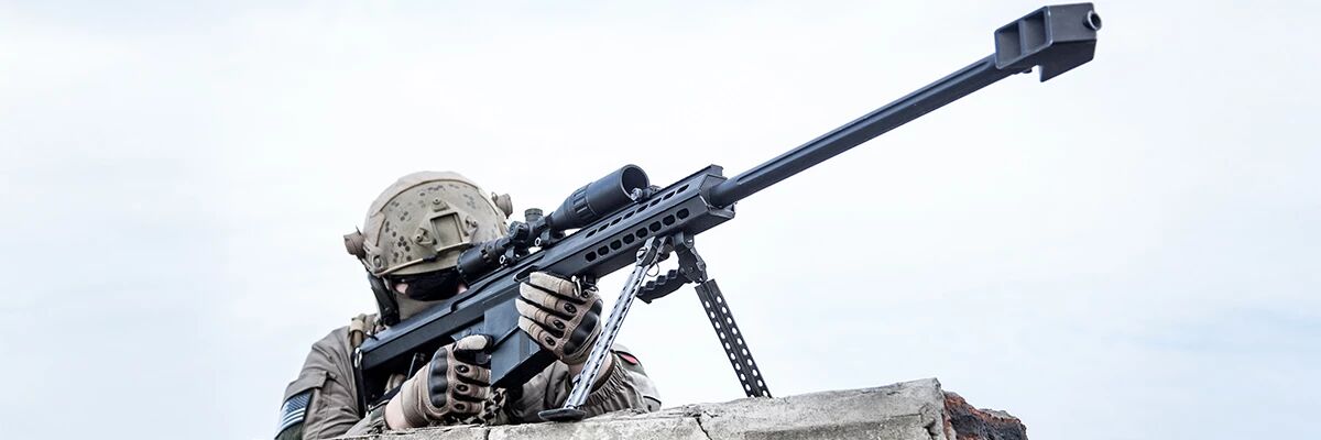 Airsoft sniper player with an M82 Barrett 